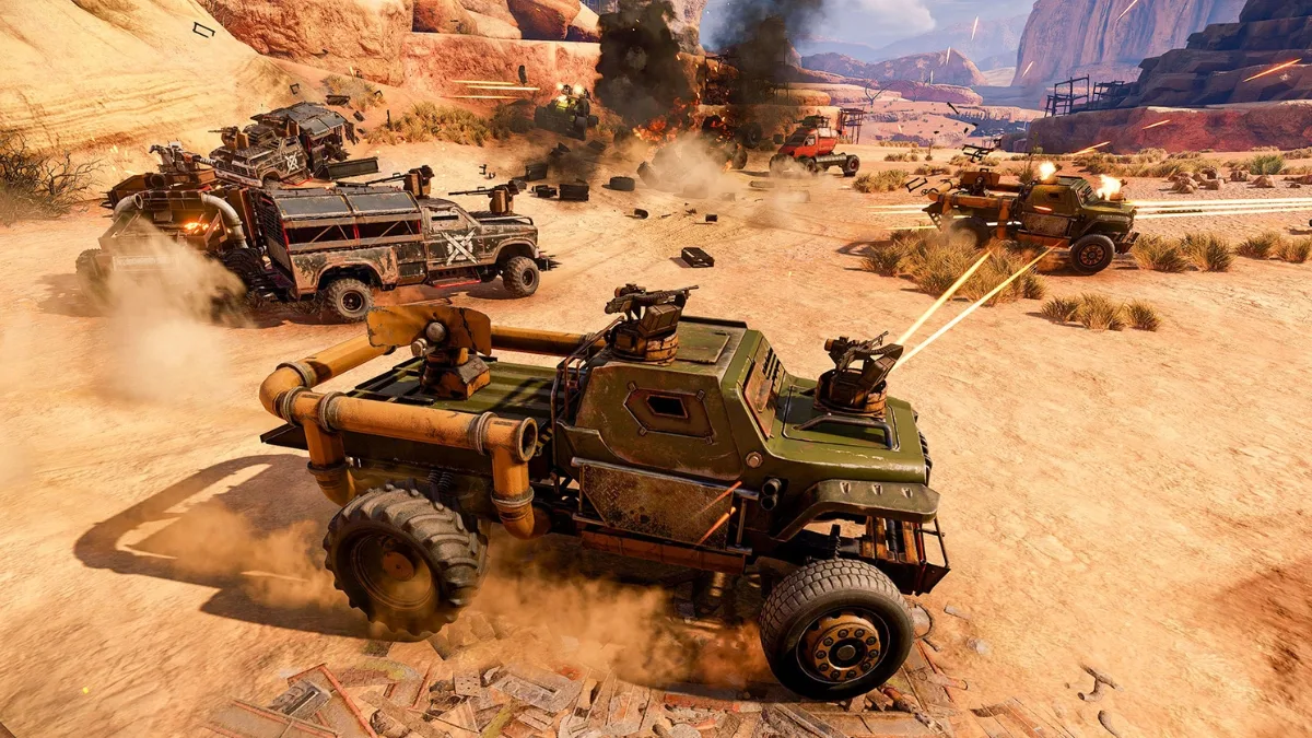 Pojazdy bojowe walczące na pustyni w trybie Crossout Rust Dust, eksplozje i opancerzone auta w dynamicznej bitwie PvP